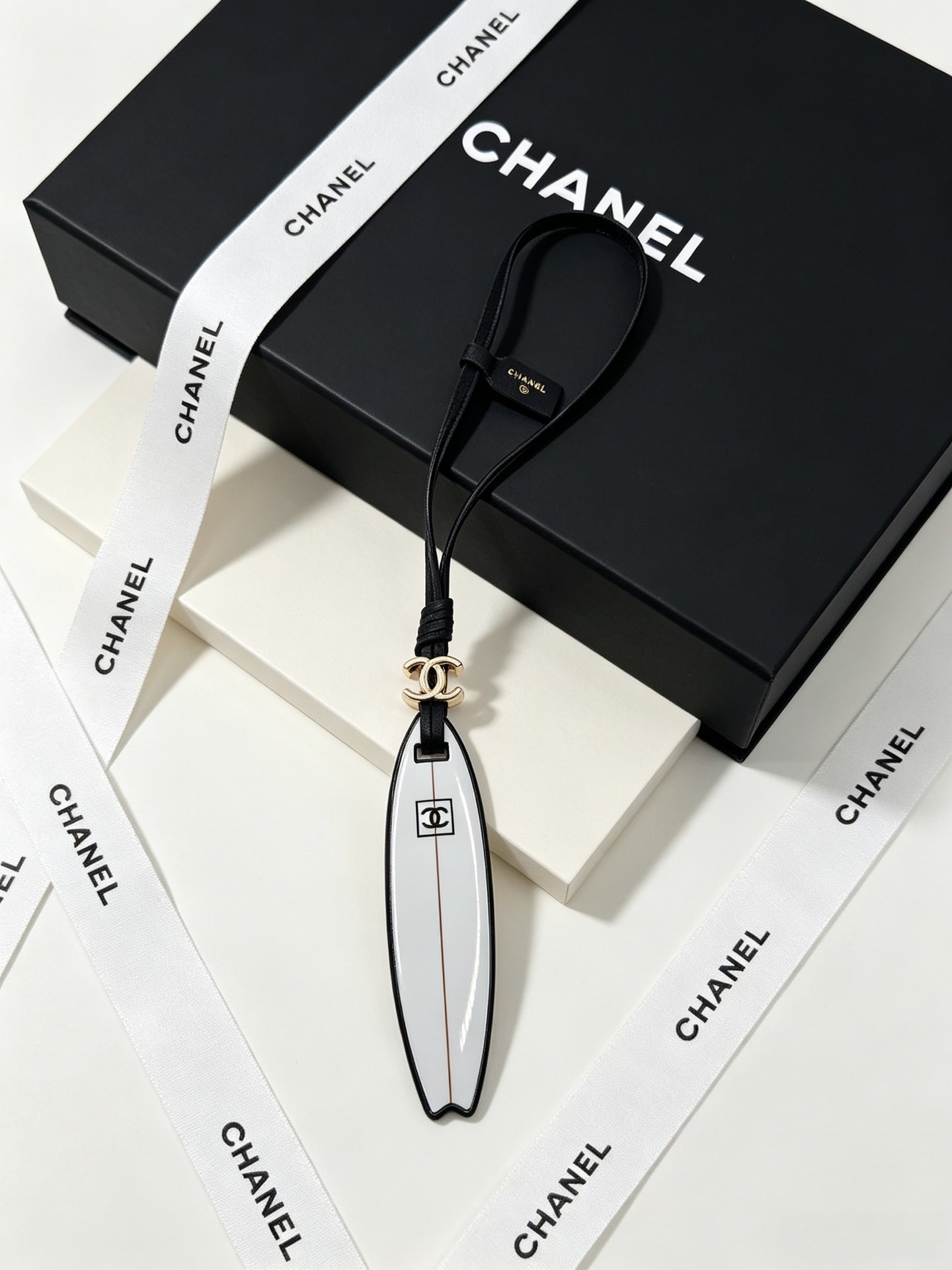 CC Surfboard-shaped Leather Cord Charm