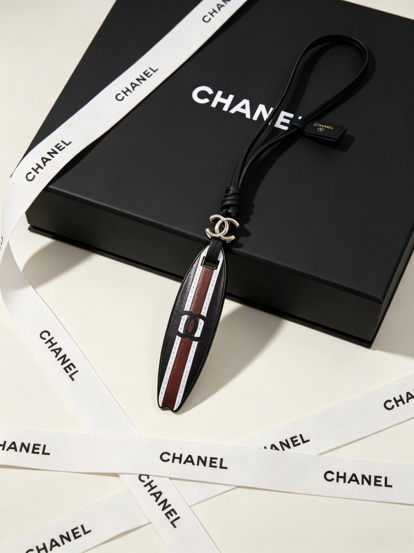 CC Surfboard-shaped Leather Cord Charm